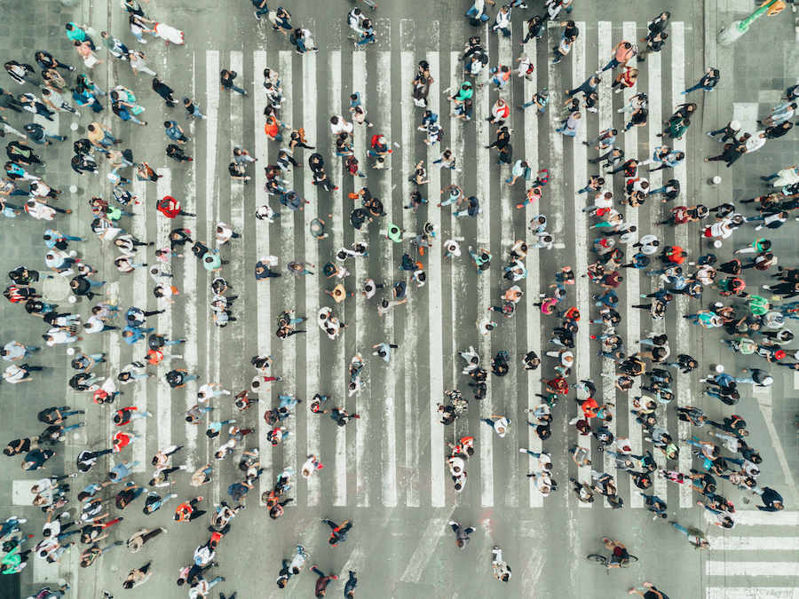 Overhead photograph of people crossing the street